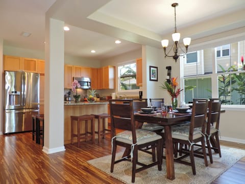 Sophisticated dining area with seating for six, perfect for shared island feasts