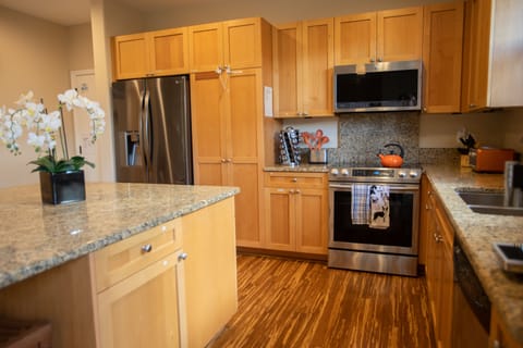 Gourmet kitchen featuring a Jura espresso machine and premium granite finishes.