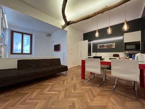 Comfort Triple Room | Living area | Flat-screen TV