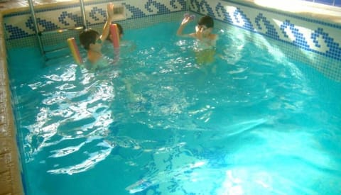 Indoor pool, pool umbrellas, sun loungers