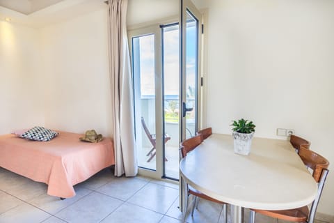 Superior Apartment, Sea View | Desk, iron/ironing board, free cribs/infant beds, bed sheets