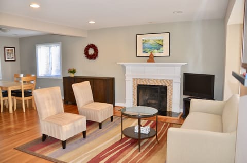 Bright and open living room, connected to dining room