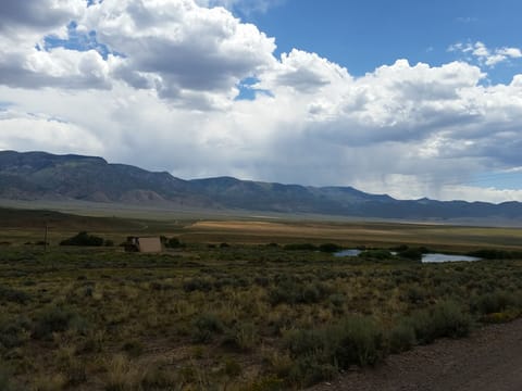 cabin with  pond and empty valley. short ride to forest/mountains