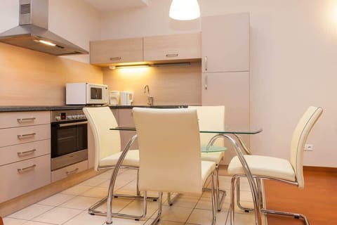 Another view of the kitchen highlighting its sleek design and functionality.
