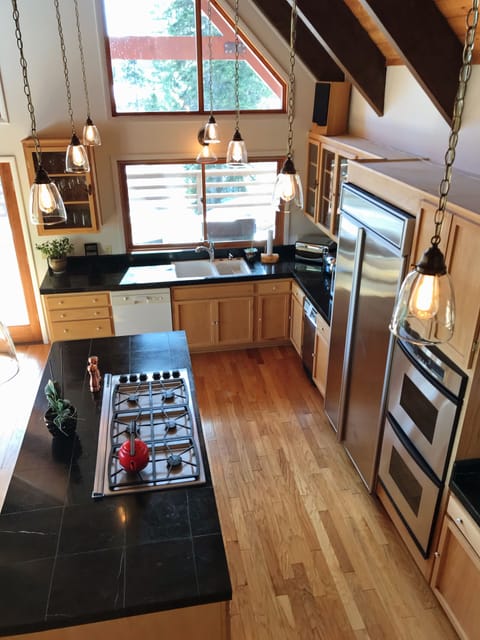 Kitchen includes 6 burner gas range and double oven