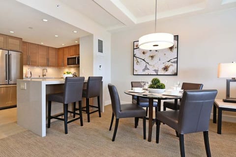 Enjoy meals at the four-seat table or have a casual snack at the kitchen bar seating. The kitchen has appliances for all your cooking needs.