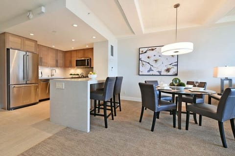 This bright, modern kitchen is fully stocked with cookware. Just bring your groceries! Features include a full fridge/freezer and microwave.