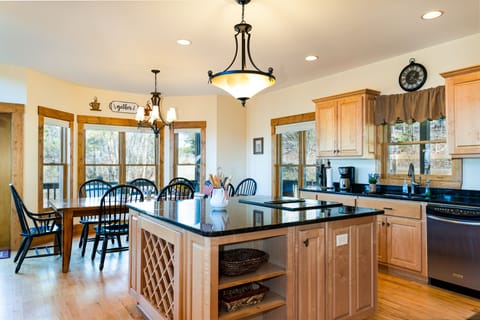 Spacious kitchen with stainless steel appliances and granite counter tops.