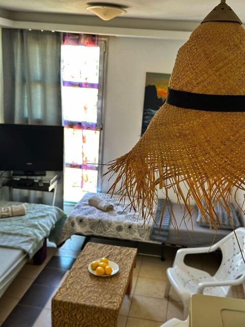 Family Apartment, 1 Bedroom, City View | Living area | 32-inch flat-screen TV with cable channels, TV