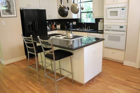 Shared fridge, shared microwave, stovetop, cookware/dishes/utensils