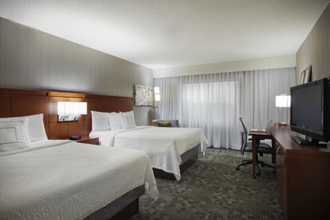 Room, 2 Queen Beds, Courtyard View | Desk, blackout drapes, iron/ironing board, free cribs/infant beds