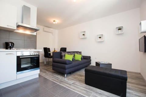 Apartment (Standard One Bedroom) | Living room | Flat-screen TV