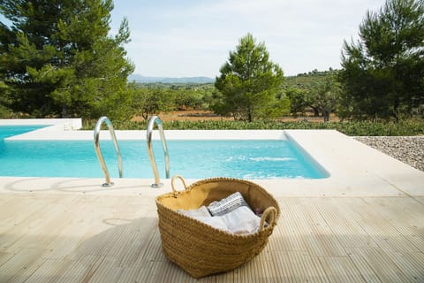 Seasonal outdoor pool, open 9:00 AM to 9:00 PM, pool umbrellas
