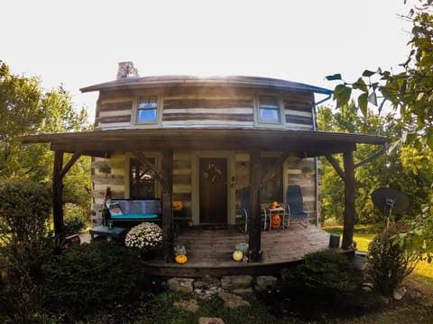 front of the cabin decorated for fall