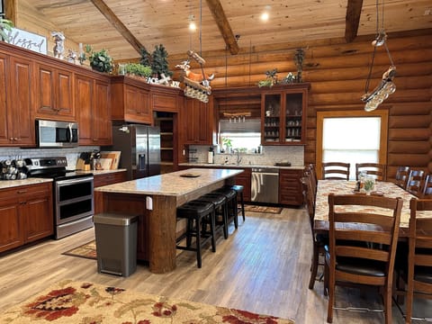 Large Kitchen, open pantry and all the conveniences needed. Seating for 16.