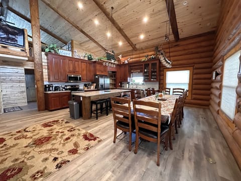 Dining table has seating for 12, plus island has seating for four.