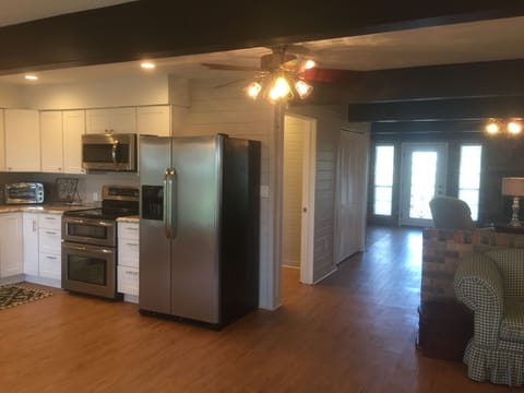 Just past the kitchen is the entry to the bathroom and after that is the laundry