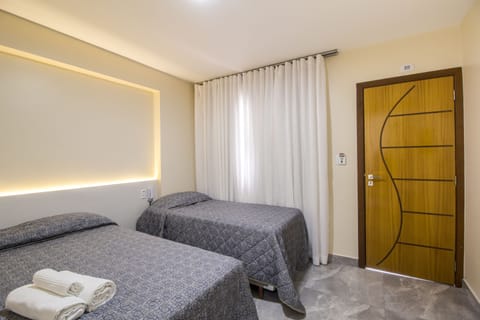 Standard Triple Room, Multiple Beds, Non Smoking | Minibar, blackout drapes, soundproofing, free WiFi