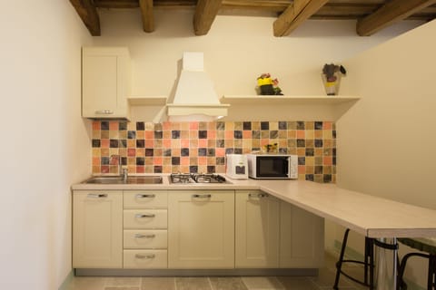 Deluxe Apartment, Patio, Garden View (Clarissa) | Private kitchen | Full-size fridge, espresso maker