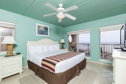 Our primary bedroom has a king-size bed and a beautiful view of the ocean.
