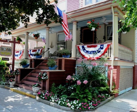 Charming Cape May Victorian with inviting front porch just steps from the beach.