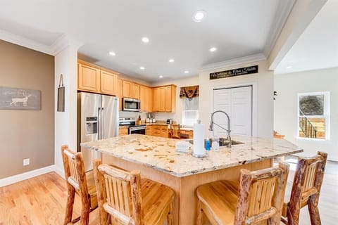 Rustic kitchen bar with lodge style stools