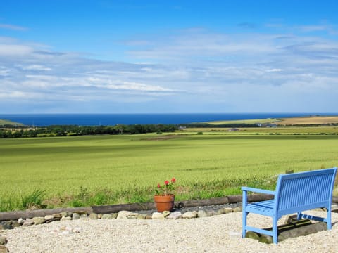 Sitting out area with sweeping panoramic sea views | The Brae Steading, Fordyce