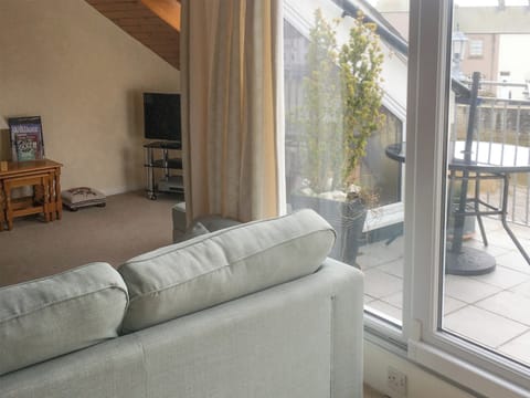 Airy living room with access to the balcony | Harbour Cottage, Haverigg, near Millom