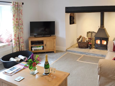 Well presented living room with wood burner | Dairy House Farm, Bickenhall, near Taunton