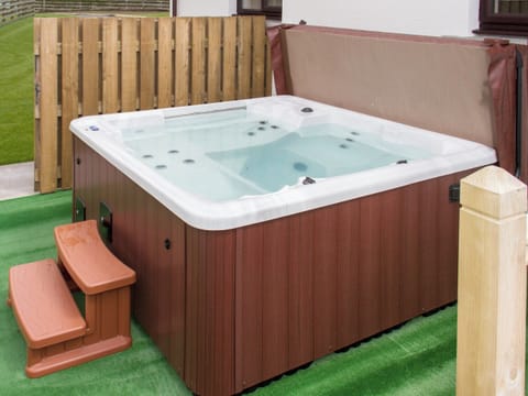 Relax in the luxurious hot-tub | Seascape - Seascape Cottages, Southerness, near Dumfries