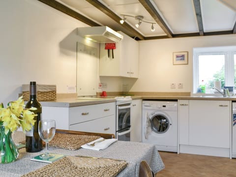 Characterful wooden beamed ceiling within kitchen | Blairhosh Cottage, Balloch, Loch Lomond
