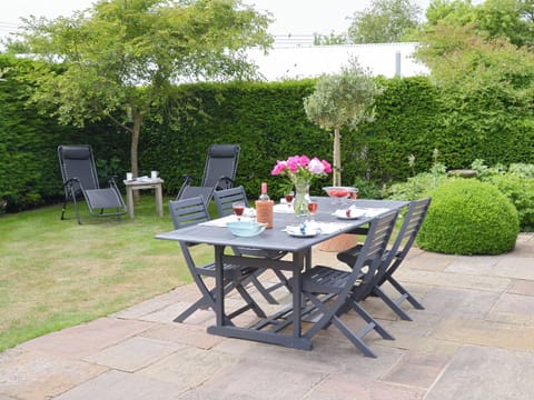 Paved patio area with outdoor furniture | The Stables, Occold, near Eye