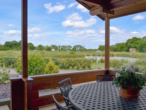 Sitting out area with lovely views | Willow Lodge - Faulkers Lakes, Burgh le Marsh, near Skegness