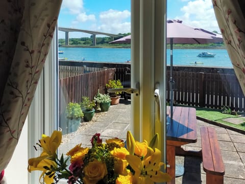 View through patio doors to river | Riverside Mews, Bideford
