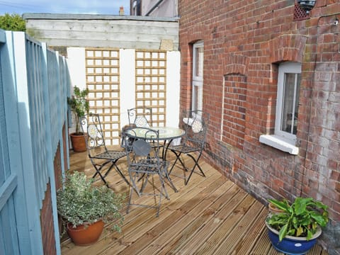 Enclosed courtyard garden, sitting-out area and furniture | Samphire, Cromer