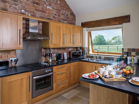 Well equipped kitchen with breakfast bar | Blackberry Barn - Middle Huntingford Barns, Charfield, near Wotton-under-Edge