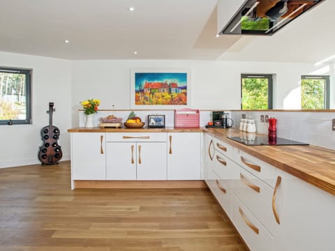 Wooden floors throughout the kitchen and living areas | Strathspey Lodge, Duthil, Carrbridge, near Aviemore