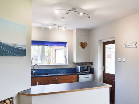 Kitchen with breakfast bar | Sea La Vie, Mundesley, near North Walsham