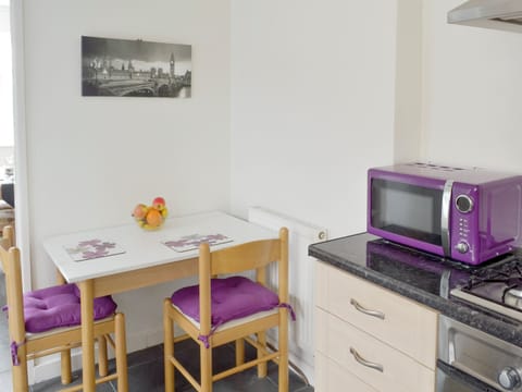 Convenient informal dining area in kitchen | Rossall Beach Cottage, Rossall, near Thornton-Cleveleys.
