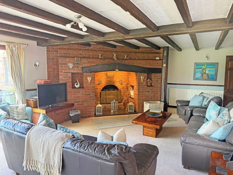Main sitting room with large inglenook fireplace | Lambourne House - Ashtree Court, Skegness