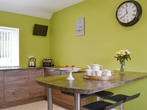 Useful breakfast bar in kitchen | Hameish Holiday Cottage, Kirkcudbright