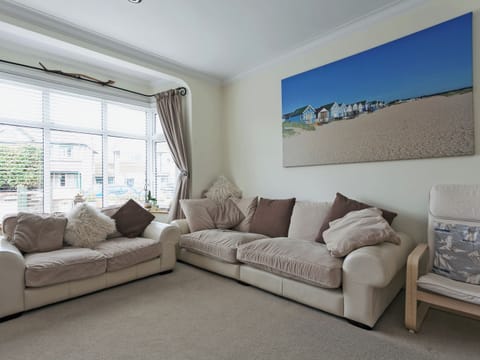 Beautifully designed living room with woodburner | Stourcliffe House, Bournemouth