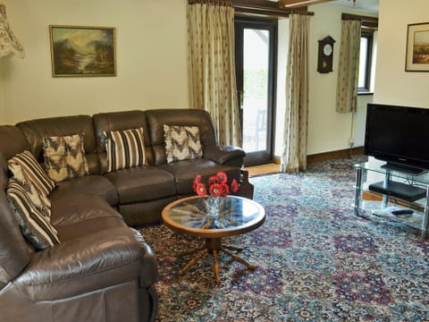 Homely living room with wood burner | Stowford Barton Cottage - Swallows Nest - Stowford Barton Cottages, Stowford, Okehampton