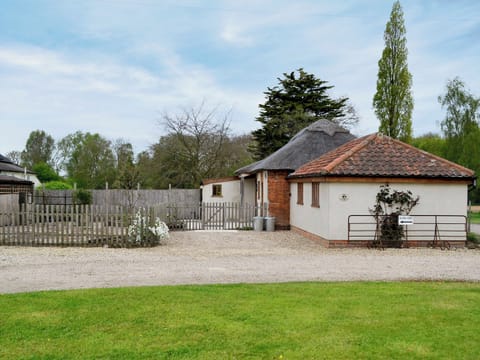 Spacious enclosed garden with sitting-out area and garden furniture | The Cowshed, Blofield, near Norwich