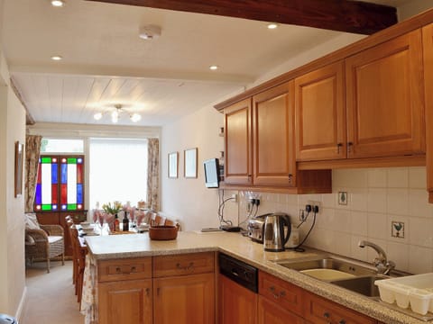 Beams in the kitchen give an air of history and heritage | The Old Post Office, Myddfai, near Llandovery