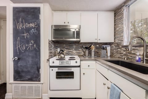 Modern- vintage kitchen fully equipped for cooking.