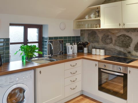 Well-equipped fitted kitchen | The Stables - Tyddyn Iolyn, near Criccieth