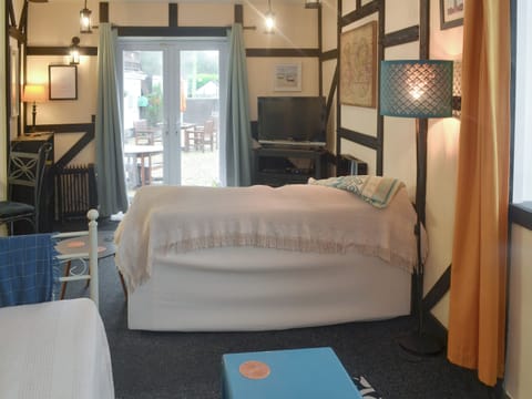 Delightful living areas with exposed wood frame throughout | The Snug - Ty Copr, Pen-y-Sarn, near Amlwch