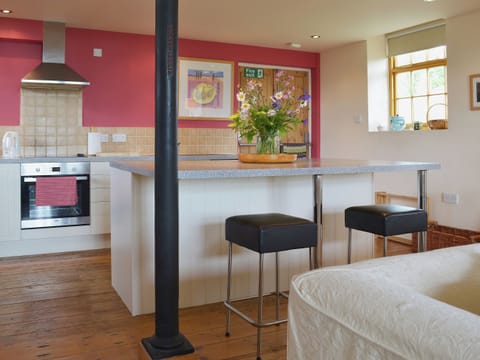 There is a comfortable breakfast bar | Little Burcott Loft, Burcott, Wells