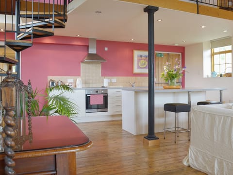 A dining area set off to one side of the open plan space | Little Burcott Loft, Burcott, Wells